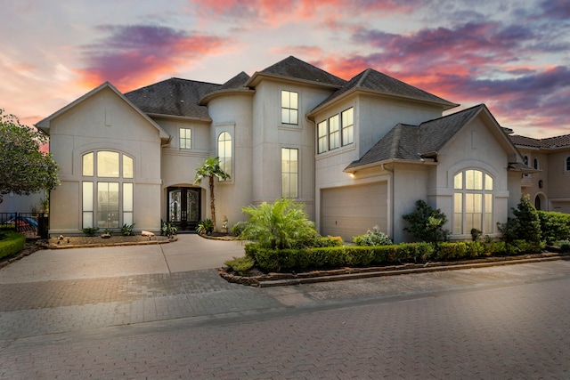 french country home with a garage