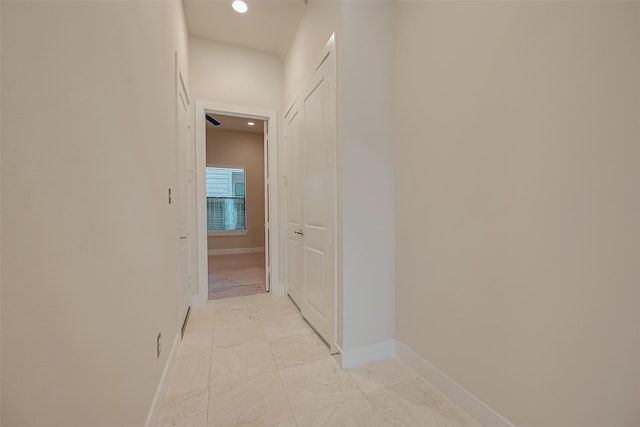 hallway featuring light tile patterned flooring