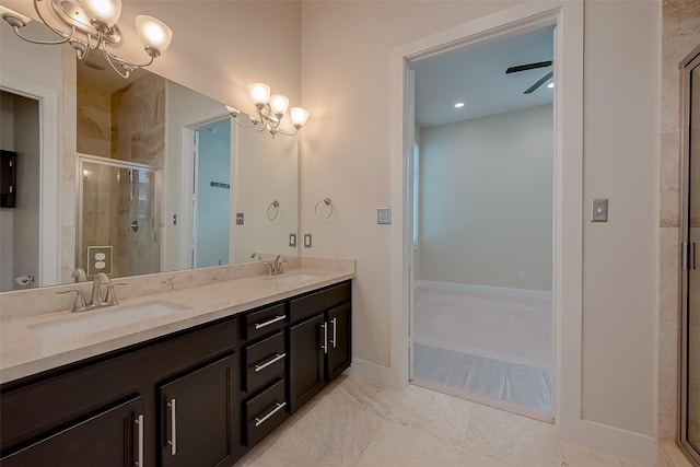 bathroom featuring ceiling fan with notable chandelier, vanity, tile patterned floors, and an enclosed shower