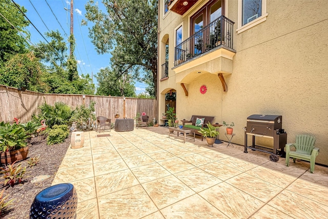 view of patio / terrace with a balcony