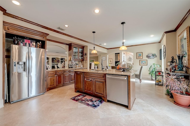 kitchen with decorative light fixtures, a center island, ornamental molding, stainless steel appliances, and light stone countertops