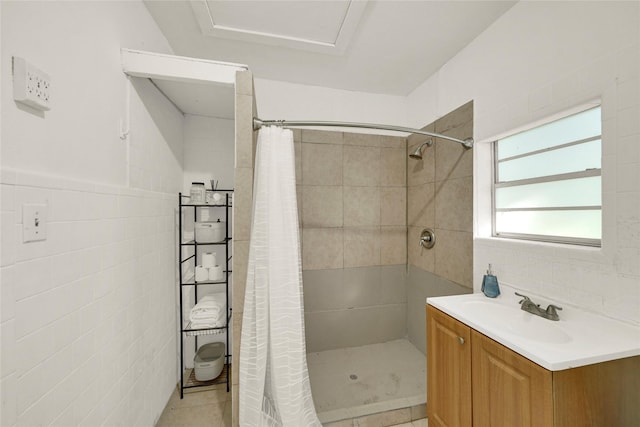 bathroom featuring vanity, tile walls, tile patterned floors, and a shower with shower curtain