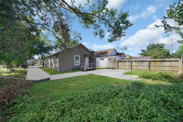 back of house with a yard