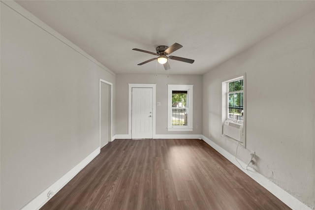 unfurnished room featuring cooling unit, dark wood-type flooring, and ceiling fan