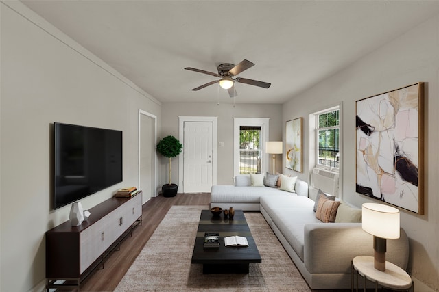 living room featuring ceiling fan and dark wood-type flooring