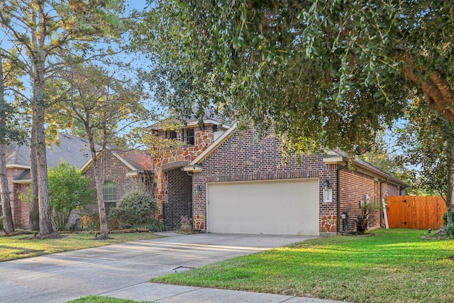 view of front property featuring a front yard and a garage