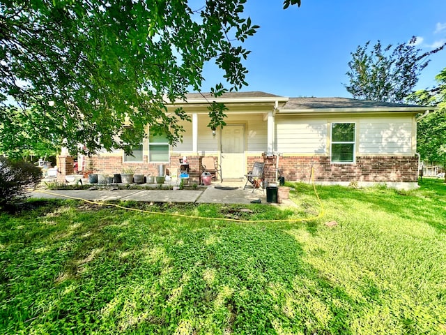 rear view of house with a lawn