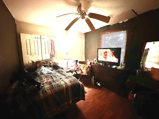 bedroom featuring wood-type flooring and ceiling fan