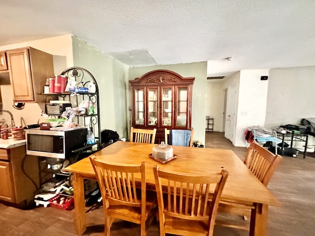 dining area with a textured ceiling