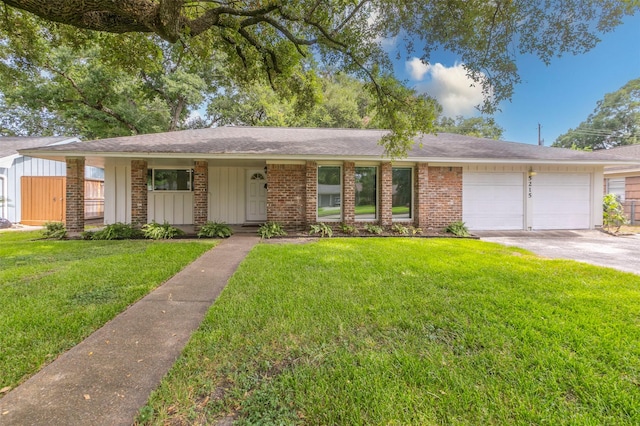 ranch-style home featuring a porch, a garage, and a front lawn