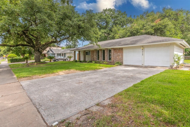 ranch-style house featuring a garage and a front yard