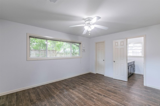 unfurnished bedroom with dark hardwood / wood-style flooring and ceiling fan