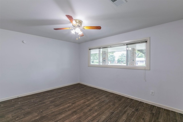 spare room with ceiling fan, dark hardwood / wood-style flooring, and a healthy amount of sunlight