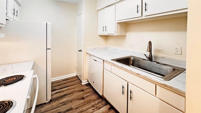 kitchen featuring white cabinetry, dark hardwood / wood-style flooring, sink, and white appliances