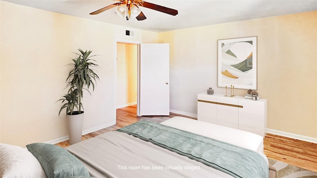 bedroom featuring light hardwood / wood-style floors and ceiling fan