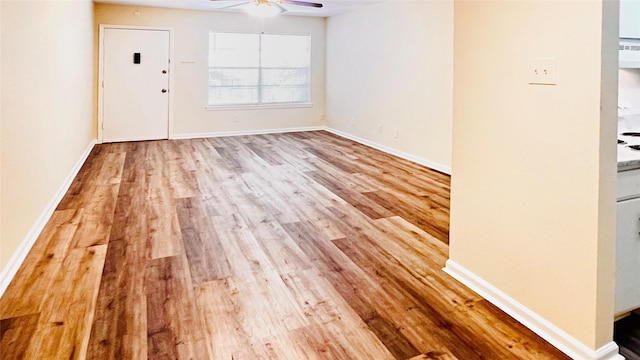 interior space featuring ceiling fan and light hardwood / wood-style flooring