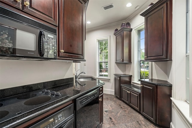 kitchen featuring black appliances, crown molding, sink, dark stone countertops, and dark brown cabinetry