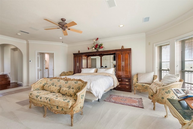 carpeted bedroom featuring ceiling fan and ornamental molding