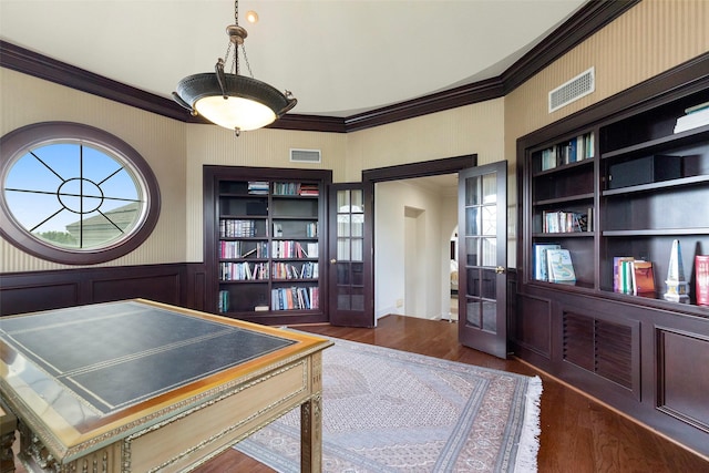 office area with built in shelves, crown molding, and dark hardwood / wood-style flooring