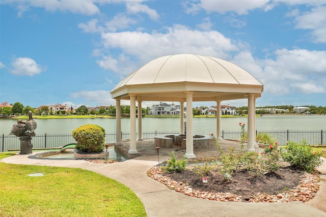 view of dock with a water view and a gazebo