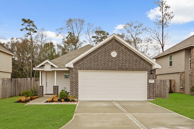 view of front of home with a garage and a front yard