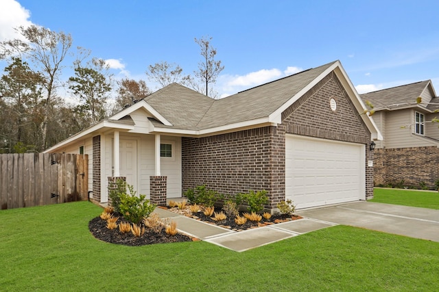 view of front of property with a garage and a front yard