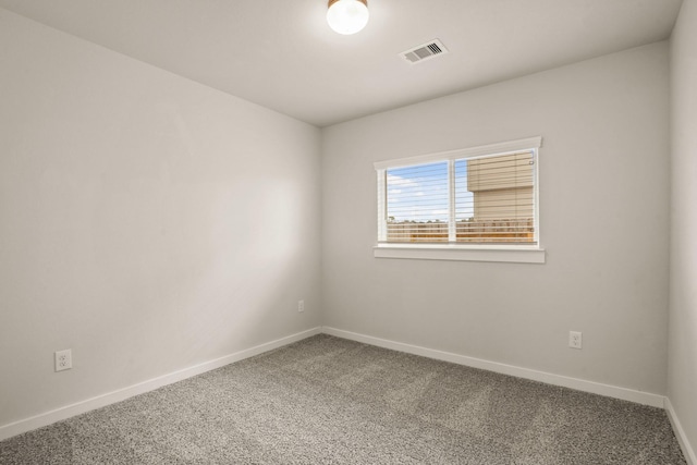 empty room featuring carpet floors