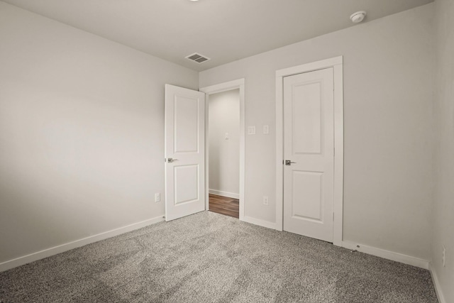 unfurnished bedroom with carpet floors