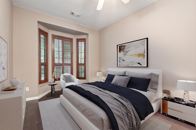 bedroom with visible vents, a ceiling fan, and baseboards