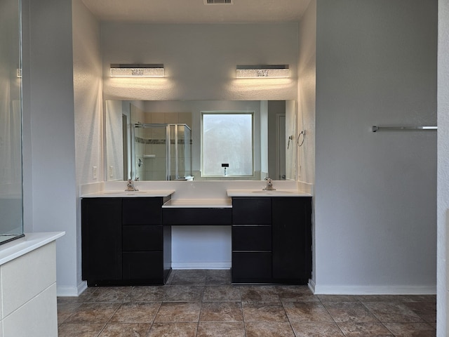 bathroom with vanity and an enclosed shower