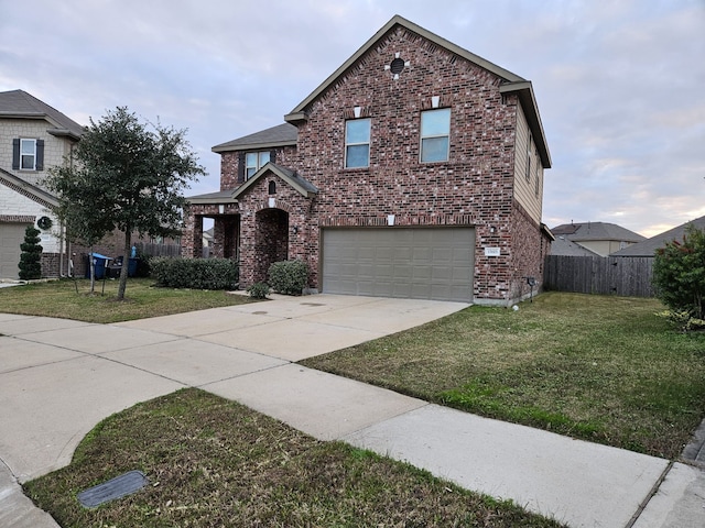 view of property with a front yard and a garage