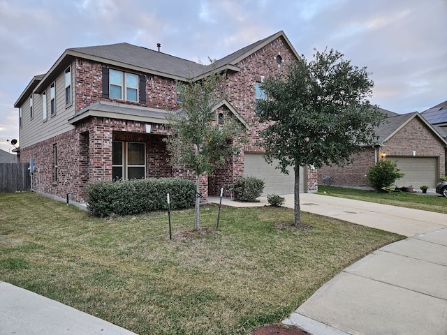 view of front of home with a garage and a front yard