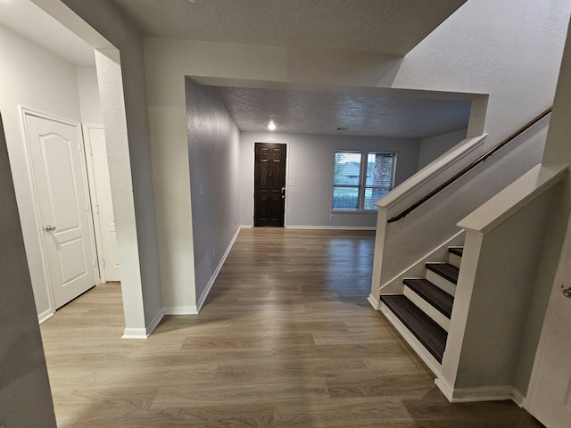 hallway featuring light hardwood / wood-style flooring