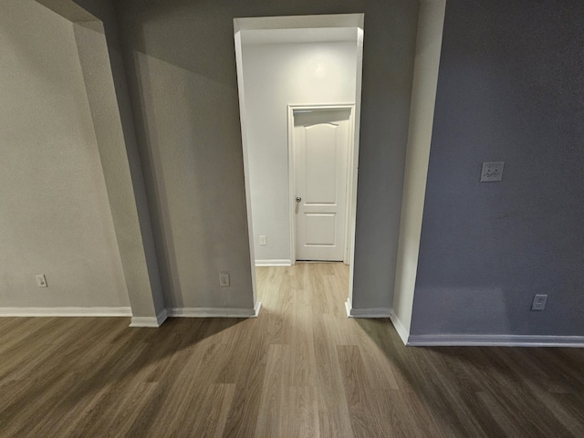 spare room with wood-type flooring