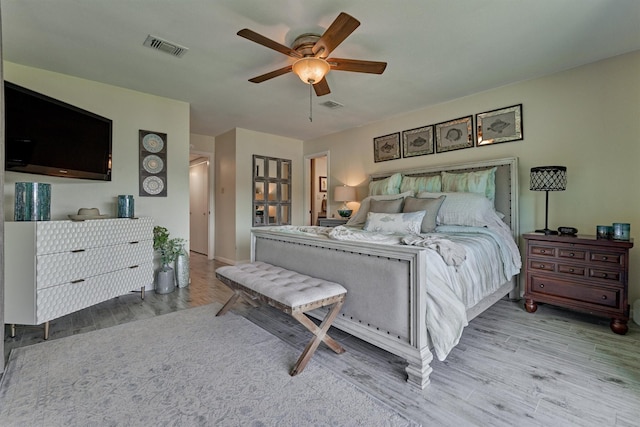 bedroom featuring light hardwood / wood-style flooring and ceiling fan