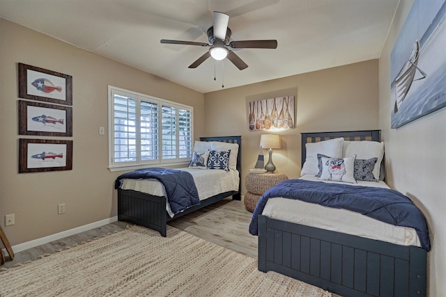 bedroom featuring ceiling fan and light hardwood / wood-style flooring