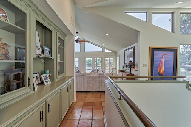 kitchen with ceiling fan, french doors, high vaulted ceiling, and tile patterned flooring