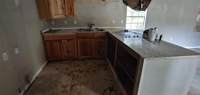 kitchen featuring stainless steel gas cooktop and sink