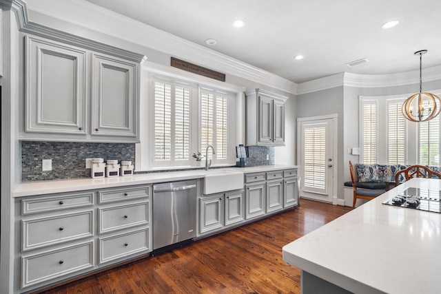 kitchen with gray cabinetry, backsplash, sink, stainless steel dishwasher, and dark hardwood / wood-style flooring