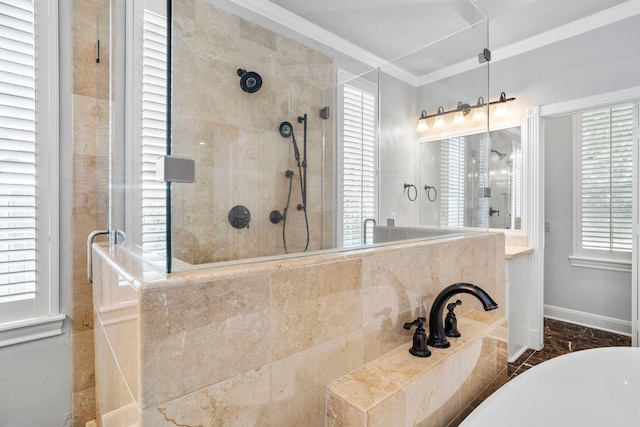 bathroom with ornamental molding and shower with separate bathtub