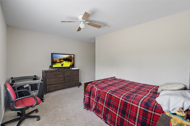 bedroom with light carpet and ceiling fan