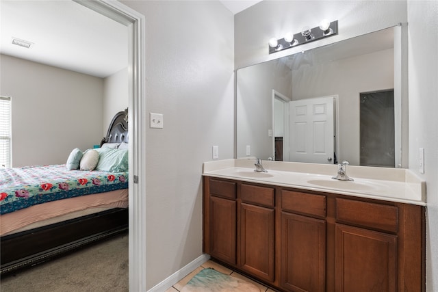 bathroom featuring double vanity and tile patterned flooring