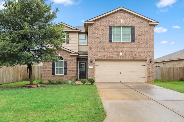 view of front property featuring a garage and a front lawn