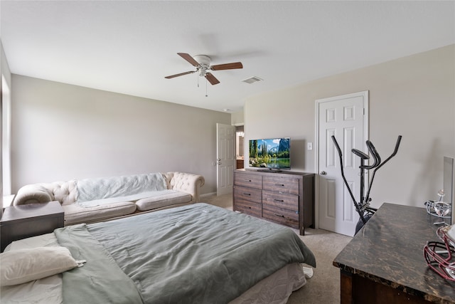 bedroom with light colored carpet and ceiling fan