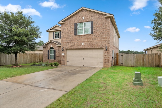 view of property featuring a garage and a front lawn