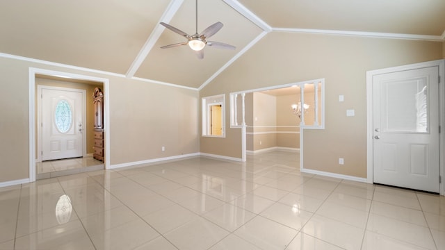 interior space featuring light tile patterned floors, ceiling fan with notable chandelier, vaulted ceiling, and ornamental molding