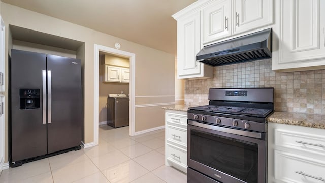 kitchen featuring light stone counters, ventilation hood, stainless steel appliances, washer / clothes dryer, and white cabinetry