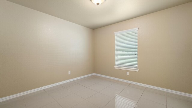 2715 Toyah Ave, Houston, TX 77039 - spare room with baseboards and light tile patterned floors