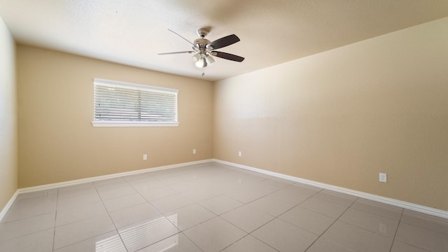 2715 Toyah Ave, Houston, TX 77039 - unfurnished room with light tile patterned flooring, ceiling fan, and baseboards