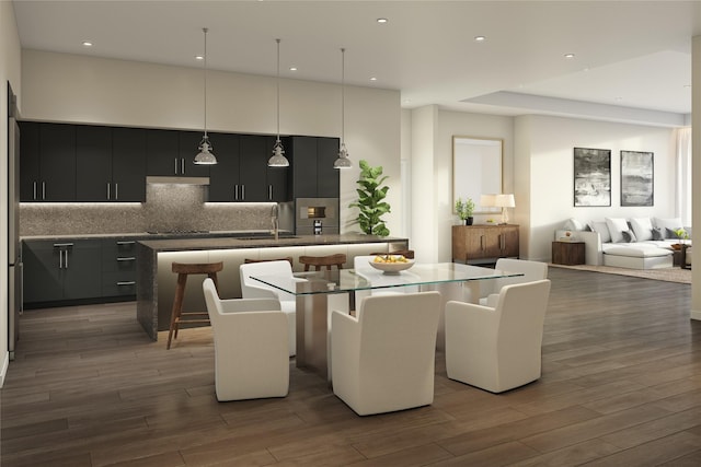 dining room with sink and dark hardwood / wood-style floors